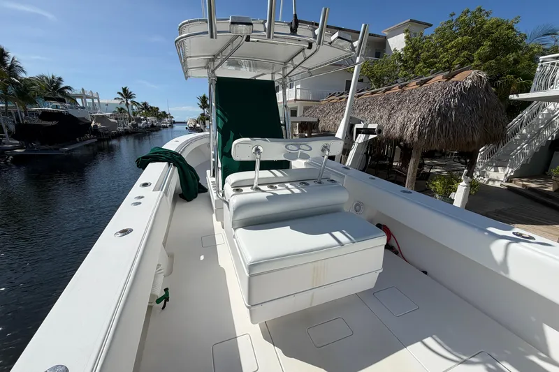 Slide: The Image of 2007 Contender 33 Tournament boat docked in a sunny canal setting. - 19