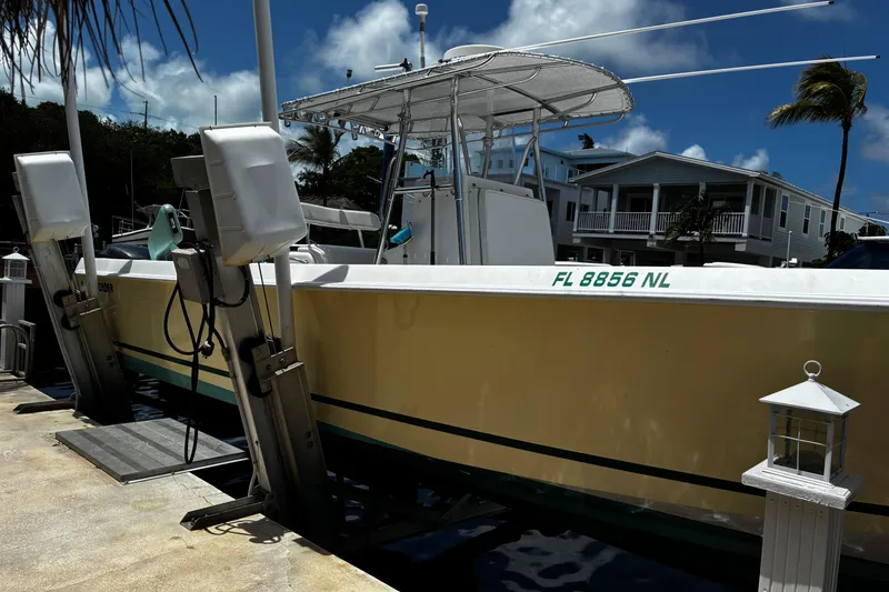 Slide: The Image of 2007 Contender 33 Tournament boat docked, featuring a sleek design and sunny backdrop. - 5