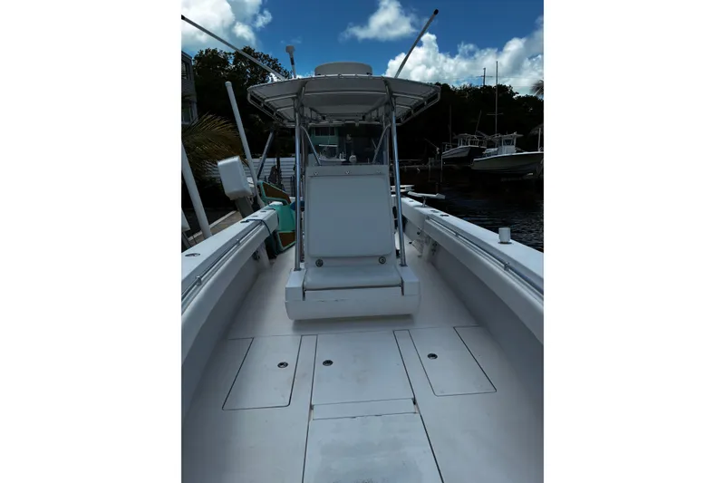 Slide: The Image of 2007 Contender 33 Tournament boat docked, featuring spacious deck and center console. - 8