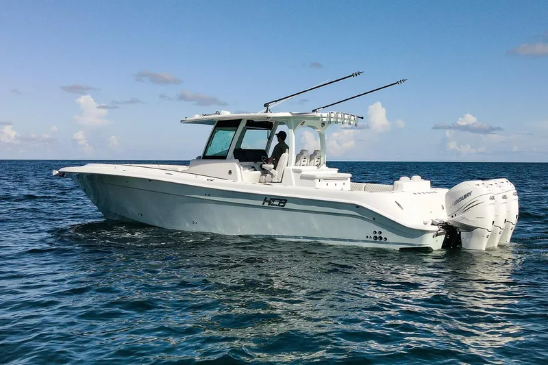 The Image of 2027 HCB 39 Speciale boat cruising on open water under clear skies. - 0
