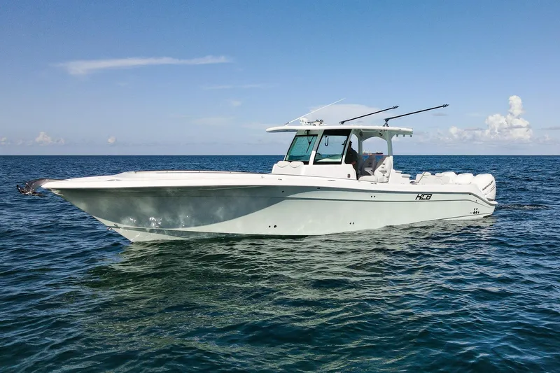 Slide: The Image of HCB 39 Speciale 2027 boat cruising on open sea under clear blue sky. - 1