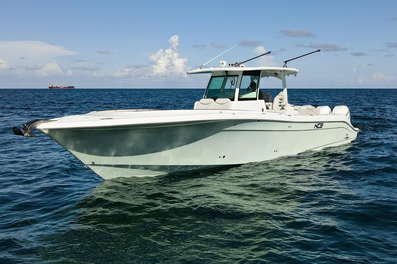 Slide: The Image of 2027 HCB 39 Speciale boat cruising on open sea under clear skies. - 10