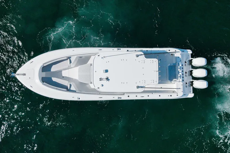 Slide: The Image of Aerial view of 2027 HCB 39 Speciale boat cruising on clear water. - 11