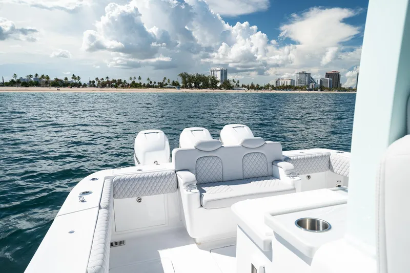 Slide: The Image of Luxury HCB 39 Speciale boat cruising near a scenic coastline, 2027 model. - 15