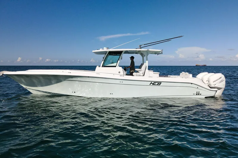Slide: The Image of HCB 39 Speciale 2027 boat cruising on open water under clear blue sky. - 2