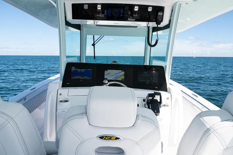 Slide: The Image of Helm of 2027 HCB 39 Speciale boat with advanced navigation systems on open sea. - 22