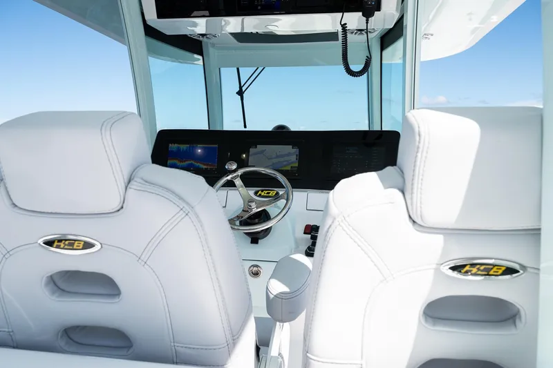 Slide: The Image of Interior view of 2027 HCB 39 Speciale boat cockpit with modern controls and seating. - 24