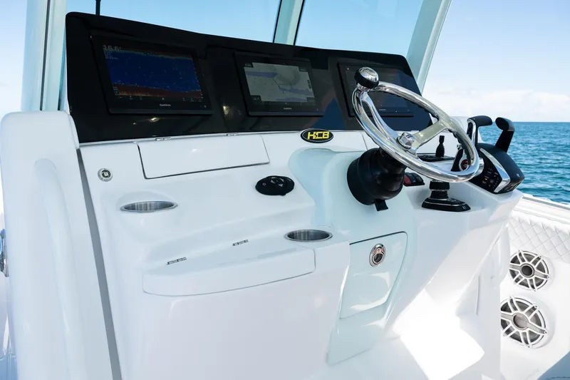 Slide: The Image of Helm of 2027 HCB 39 Speciale boat with advanced navigation displays and controls. - 25