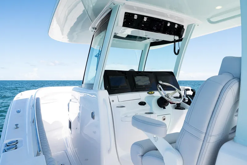 Slide: The Image of Helm of 2027 HCB 39 Speciale boat with modern controls and ocean view. - 26