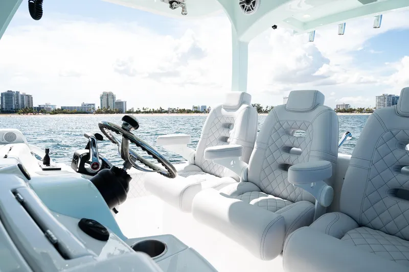 Slide: The Image of Luxurious interior of 2027 HCB 39 Speciale boat with quilted seats and ocean view. - 28