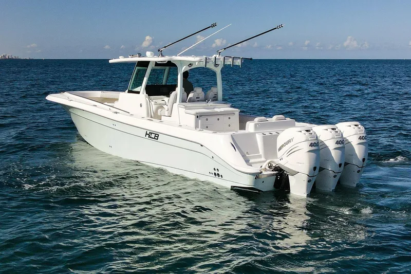 Slide: The Image of HCB 39 Speciale 2027 boat with triple Mercury engines on open sea. - 3
