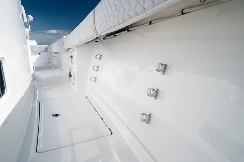 Slide: The Image of Interior view of 2027 HCB 39 Speciale boat, showcasing sleek white design and fixtures. - 36