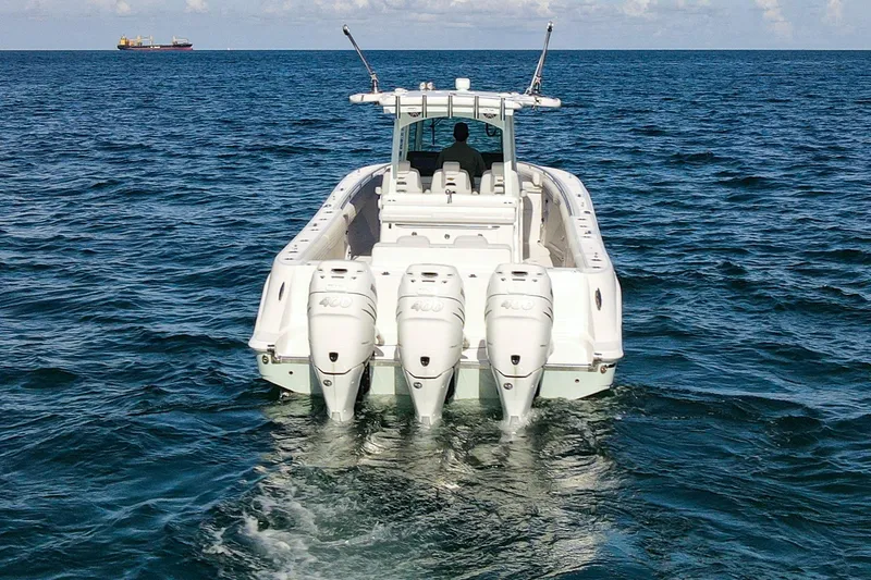 Slide: The Image of HCB 39 Speciale 2027 boat cruising on open ocean with triple engines. - 5