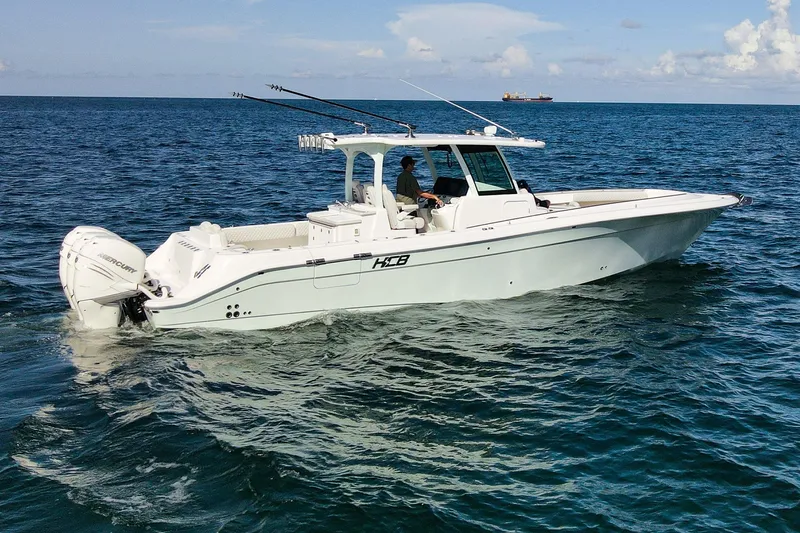 Slide: The Image of 2027 HCB 39 Speciale boat cruising on open water, featuring sleek design and powerful engines. - 6