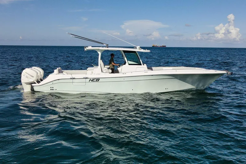 Slide: The Image of 2027 HCB 39 Speciale boat cruising on open ocean under clear skies. - 7