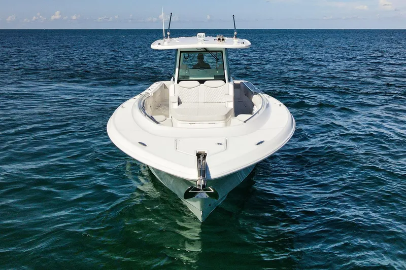 Slide: The Image of 2027 HCB 39 Speciale boat on open water, showcasing sleek design and luxury features. - 8