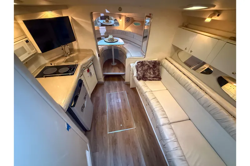 Slide: The Image of Luxurious interior of a 1997 Sea Ray 330 Express Cruiser with modern amenities. - 17