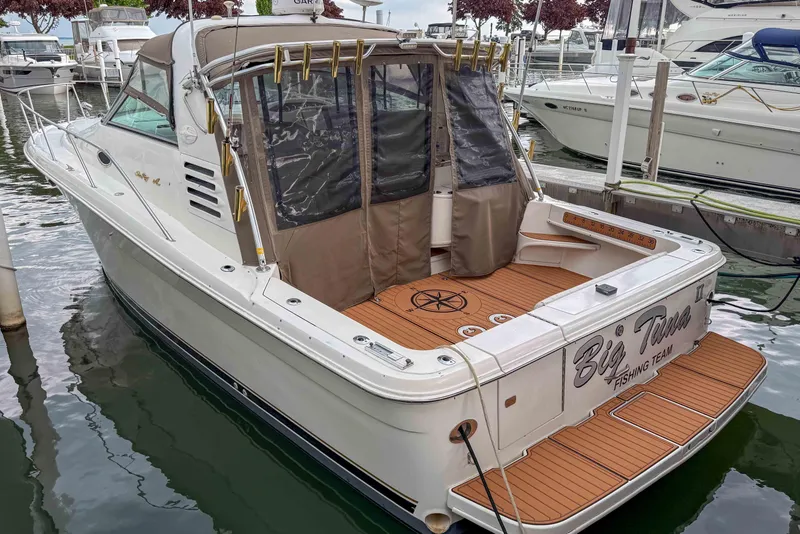 Slide: The Image of 1997 Sea Ray 330 Express Cruiser docked, featuring "Big Tuna" fishing team branding. - 4