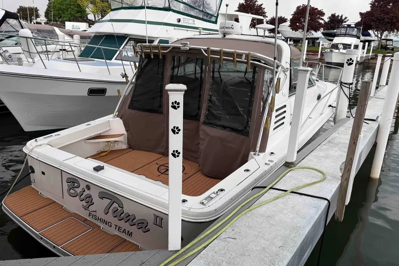 Slide: The Image of 1997 Sea Ray 330 Express Cruiser docked, featuring "Big Tuna II" fishing team branding. - 5