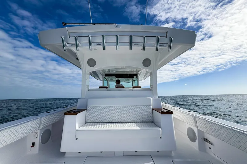 Slide: The Image of 2027 HCB 48 Campeon boat on open sea under blue sky. - 16