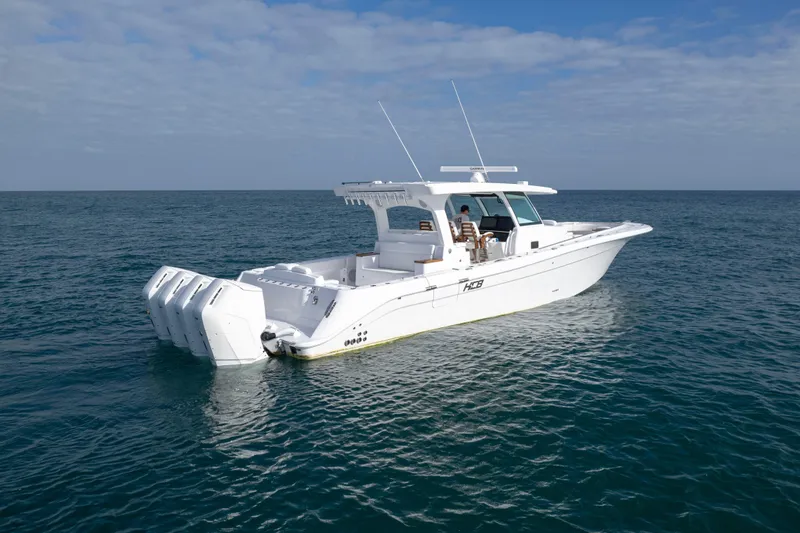 Slide: The Image of HCB 48 Campeon 2027 boat cruising on open sea under clear sky. - 2