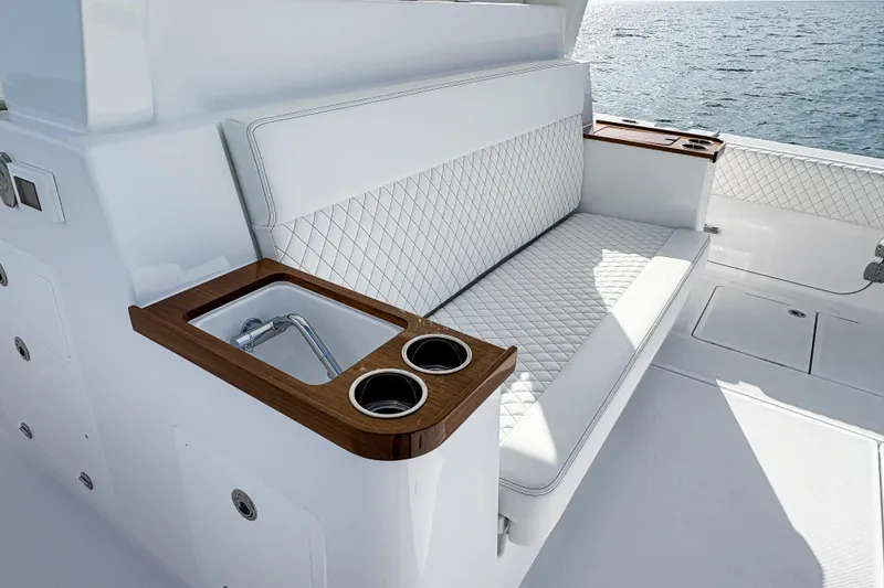Slide: The Image of Luxurious seating area on the 2027 HCB 48 Campeon yacht, featuring elegant white upholstery. - 24