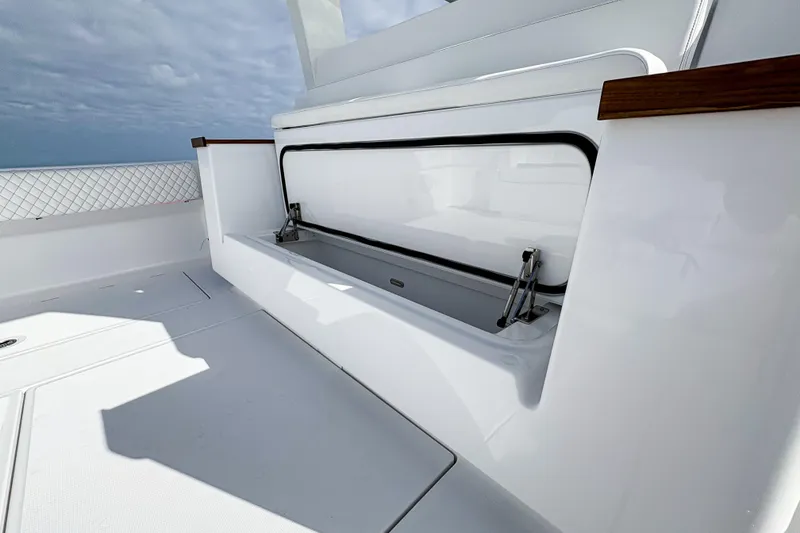 Slide: The Image of 2027 HCB 48 Campeon boat interior with sleek white storage compartment. - 25
