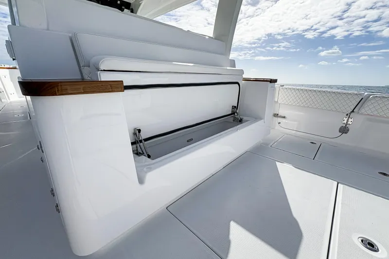 Slide: The Image of 2027 HCB 48 Campeon boat interior with sleek seating and ocean view. - 26