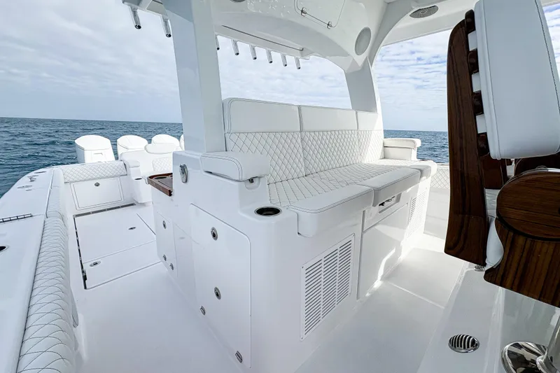 Slide: The Image of Luxurious interior of 2027 HCB 48 Campeon boat with white seating and ocean view. - 28