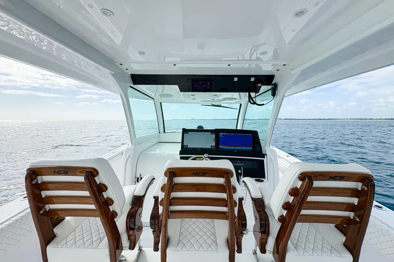 Slide: The Image of Interior view of 2027 HCB 48 Campeon boat with luxurious seating and advanced navigation system. - 32
