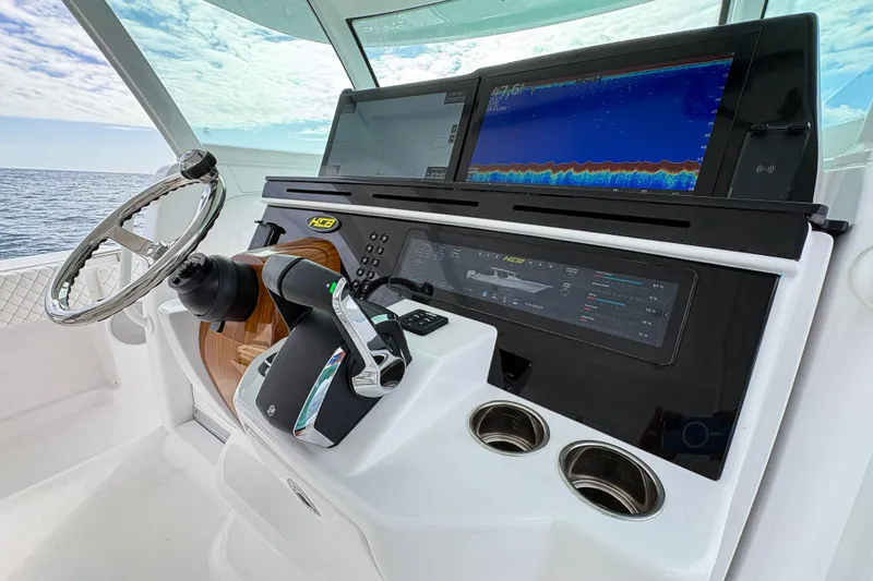 Slide: The Image of Helm of 2027 HCB 48 Campeon boat with advanced navigation displays and controls. - 34