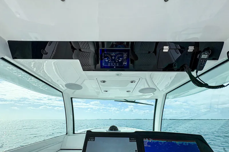 Slide: The Image of Interior view of 2027 HCB 48 Campeon boat cockpit with navigation screens. - 38