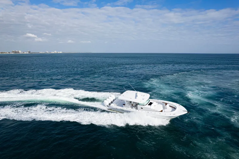 Slide: The Image of HCB 48 Campeon 2027 cruising on open ocean under clear skies. - 4
