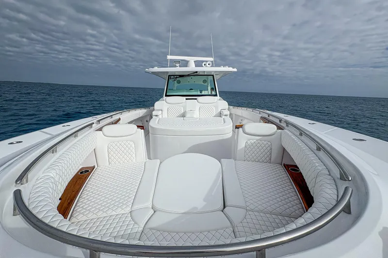 Slide: The Image of Luxurious 2027 HCB 48 Campeon yacht with elegant white seating on open water. - 43
