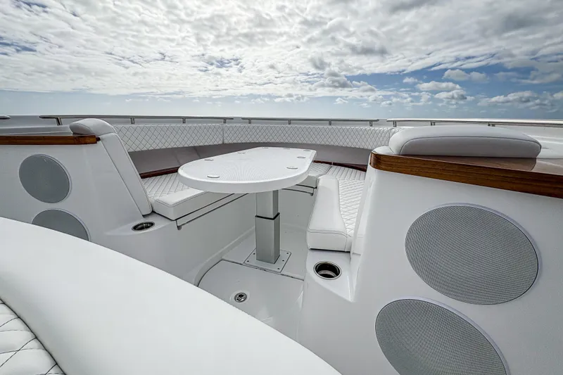 Slide: The Image of Luxurious seating area on 2027 HCB 48 Campeon yacht under a cloudy sky. - 47