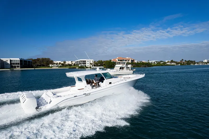 Slide: The Image of 2027 HCB 48 Campeon cruising on a sunny day in a coastal waterway. - 5