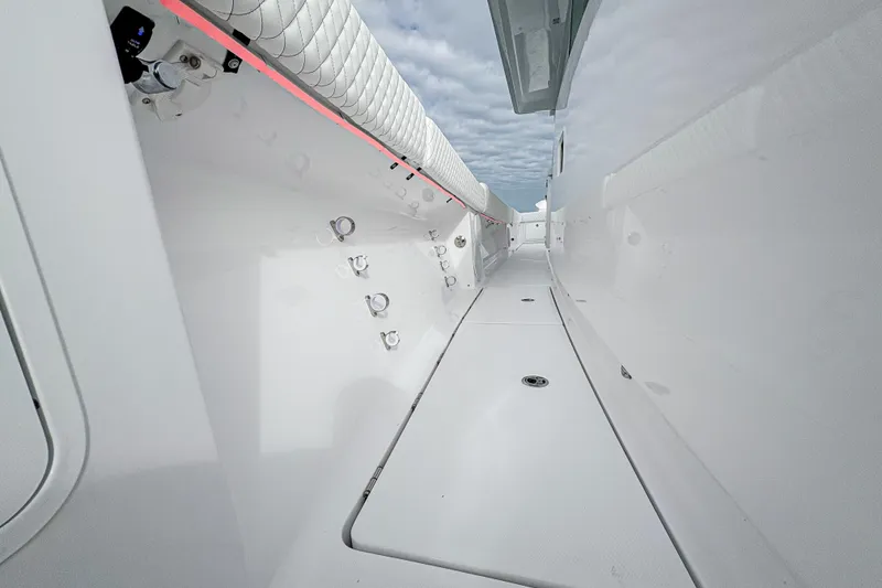 Slide: The Image of Interior view of 2027 HCB 48 Campeon boat, showcasing sleek white design and modern fittings. - 50