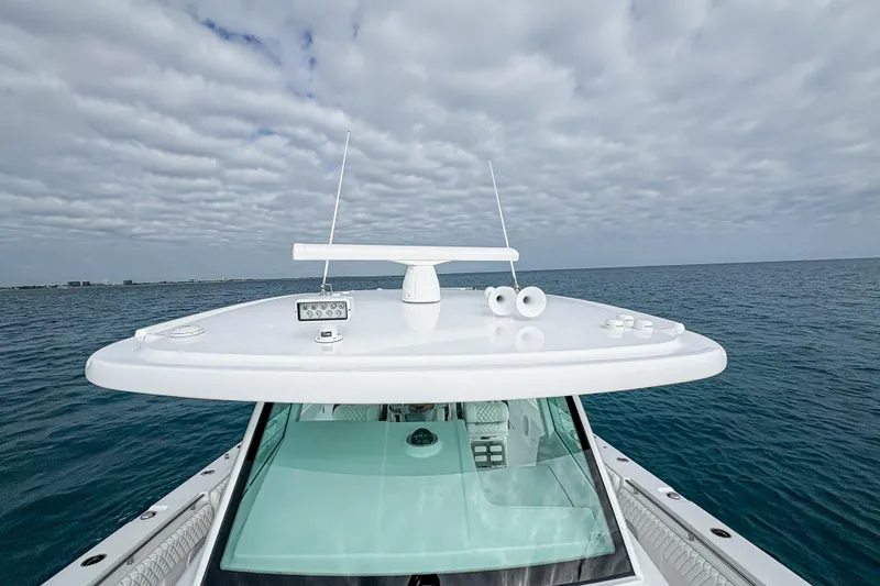 Slide: The Image of 2027 HCB 48 Campeon boat on open sea under cloudy sky. - 52