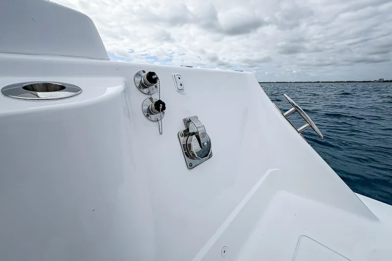 Slide: The Image of 2027 HCB 48 Campeon boat detail with ocean backdrop and cloudy sky. - 57