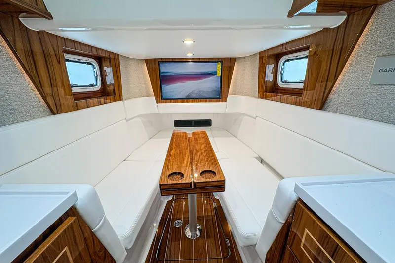 Slide: The Image of Luxurious interior of 2027 HCB 48 Campeon yacht with elegant wood and white seating. - 59