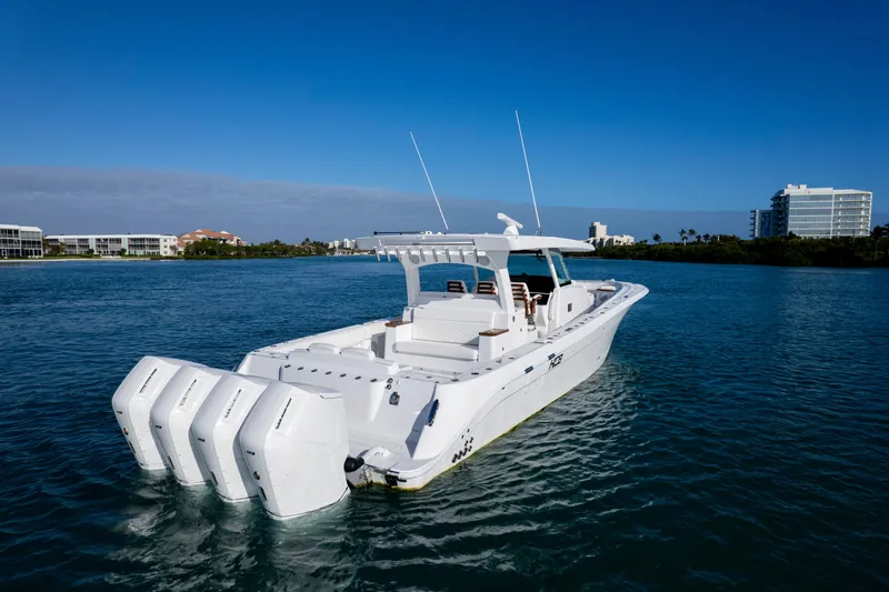 Slide: The Image of 2027 HCB 48 Campeon boat with four engines on calm water. - 6