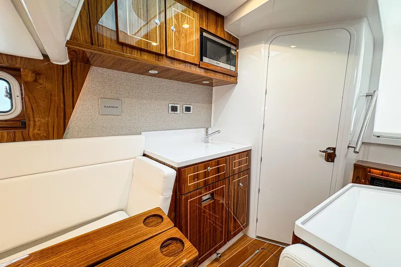 Slide: The Image of Luxurious interior of 2027 HCB 48 Campeon yacht with wood finish and modern amenities. - 62