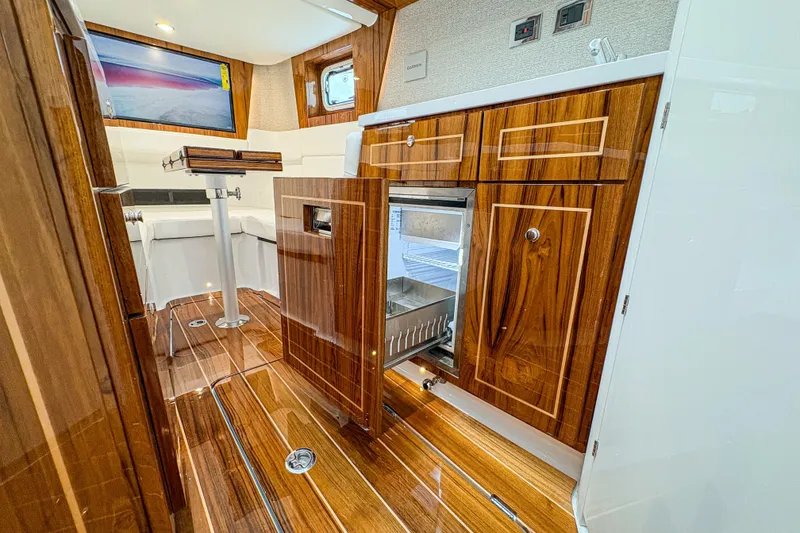 Slide: The Image of Luxurious interior of 2027 HCB 48 Campeon yacht with wood finish and modern amenities. - 64
