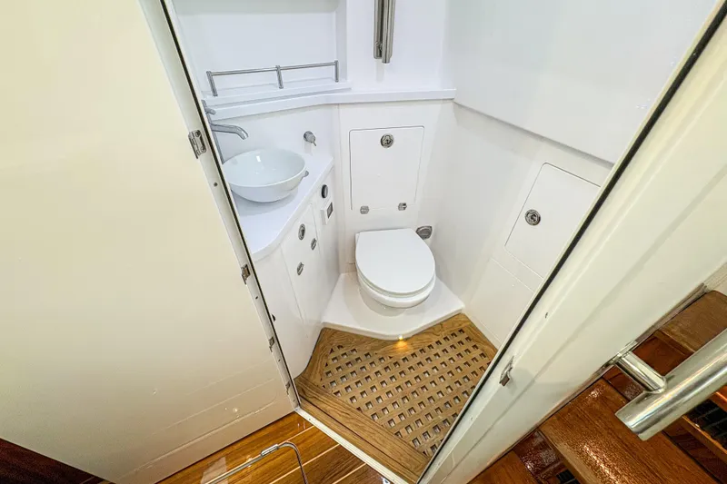 Slide: The Image of Compact bathroom in 2027 HCB 48 Campeon yacht with modern fixtures and wooden flooring. - 66