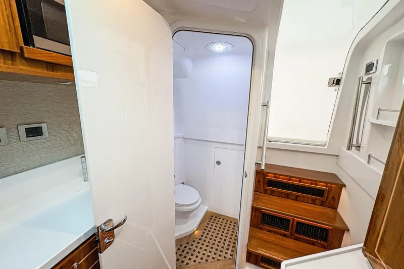 Slide: The Image of Luxurious bathroom interior of 2027 HCB 48 Campeon yacht, featuring modern amenities and wooden accents. - 68