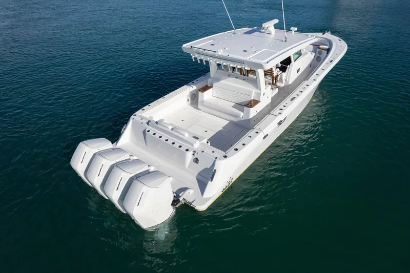 Slide: The Image of 2027 HCB 48 Campeon boat with four engines on calm water. - 8