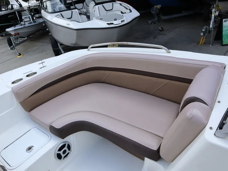Slide: The Image of Interior of 2018 Hurricane SunDeck SD 191 OB with beige seating area. - 18
