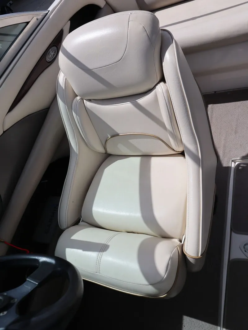 Slide: The Image of Beige leather seat in a 2001 Monterey 200LS boat. - 14