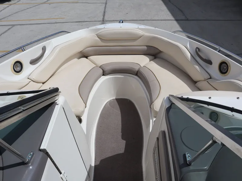 Slide: The Image of Interior view of a 2001 Monterey 200LS boat with beige seating. - 16
