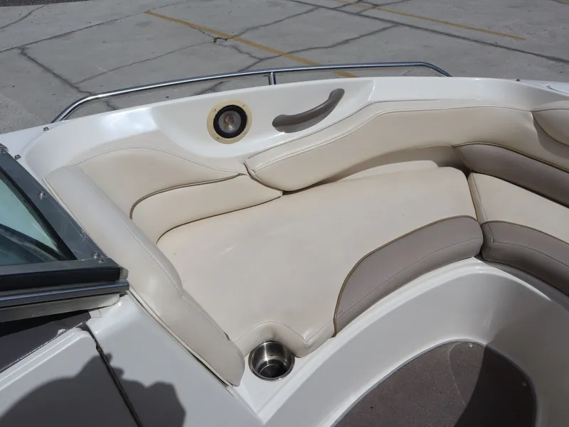 Slide: The Image of Interior of a 2001 Monterey 200LS boat with beige upholstery. - 18